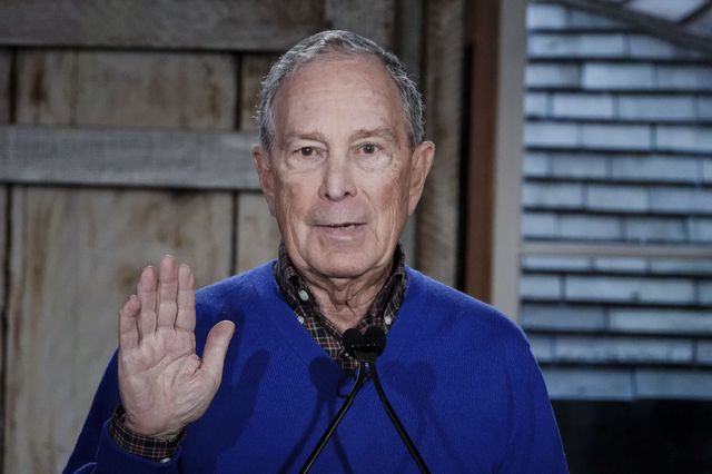 A photo of Mike Bloomberg waving